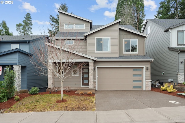 view of front of property with a garage, concrete driveway, and board and batten siding