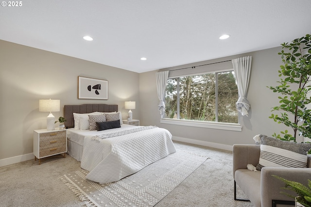 bedroom featuring light carpet, recessed lighting, and baseboards