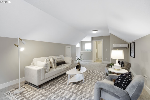 carpeted living area with lofted ceiling, a wall mounted AC, and baseboards