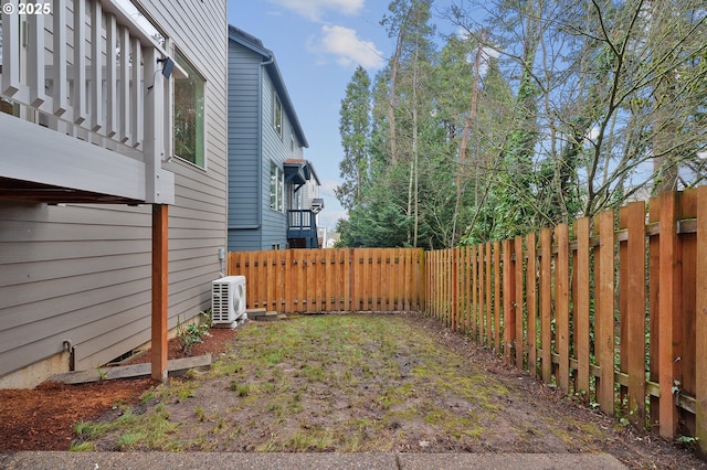 view of yard with ac unit and a fenced backyard