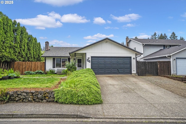 14717 NE 51st St, Vancouver, WA 98682 - single story home featuring a garage, concrete driveway, and a chimney