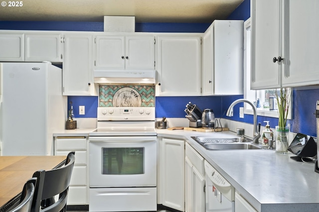 14717 NE 51st St, Vancouver, WA 98682 - kitchen with white appliances, under cabinet range hood, a sink, and light countertops