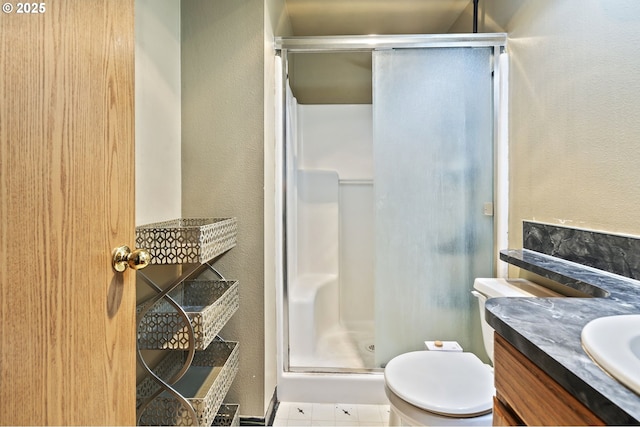 14717 NE 51st St, Vancouver, WA 98682 - bathroom with a shower stall, vanity, a textured wall, and toilet
