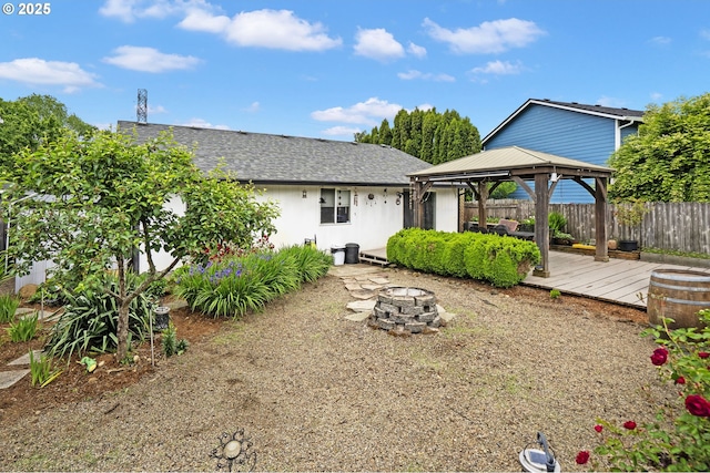 14717 NE 51st St, Vancouver, WA 98682 - back of house featuring a gazebo, a fire pit, a wooden deck, and a shingled roof