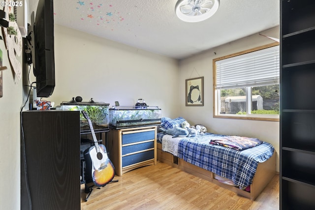 14717 NE 51st St, Vancouver, WA 98682 - bedroom featuring wood finished floors and a textured ceiling