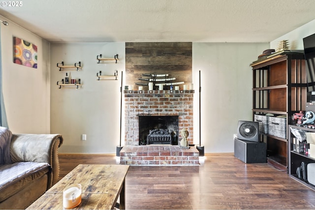 14717 NE 51st St, Vancouver, WA 98682 - living area with wood finished floors, a fireplace, and a textured ceiling
