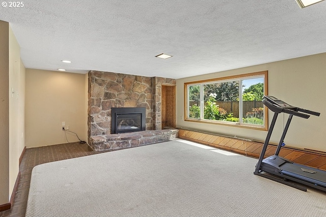 540 NE 23rd Pl, Gresham, OR 97030 - workout area with carpet, a fireplace, and a textured ceiling