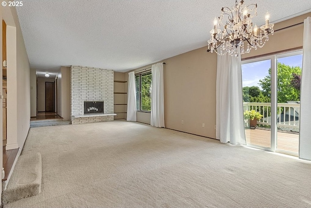 540 NE 23rd Pl, Gresham, OR 97030 - unfurnished living room featuring a textured ceiling, carpet, a chandelier, and a fireplace