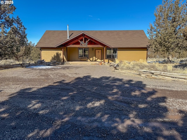 25405 SE Bear Creek Rd, Prineville, OR 97754 - view of front facade featuring covered porch