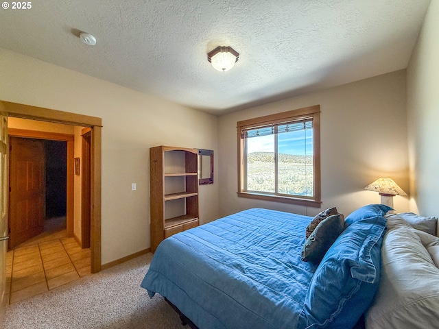 25405 SE Bear Creek Rd, Prineville, OR 97754 - bedroom featuring carpet floors, a textured ceiling, and baseboards