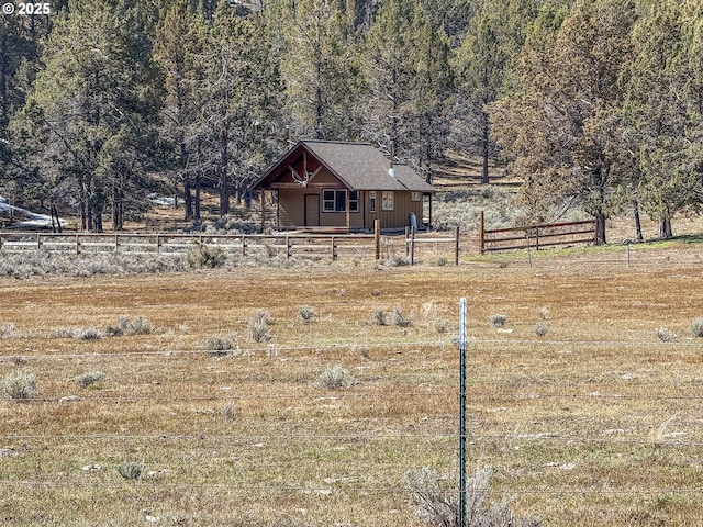 25405 SE Bear Creek Rd, Prineville, OR 97754 - view of front of house featuring a view of trees and fence