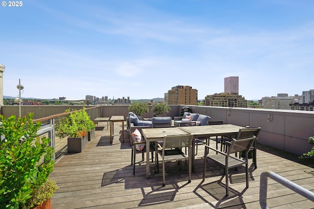 1314 NW Irving St Unit 404, Portland, OR 97209 - wooden deck featuring a view of city and outdoor dining area