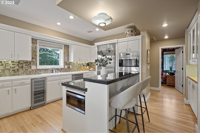 12760 S Fielding Rd, Lake Oswego, OR 97034 - living area featuring a water view, recessed lighting, and light colored carpet