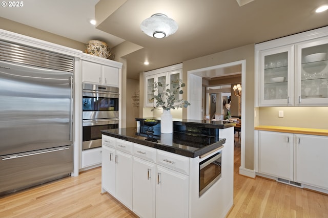 12760 S Fielding Rd, Lake Oswego, OR 97034 - living room featuring recessed lighting, stairway, and a fireplace