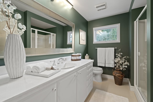 12760 S Fielding Rd, Lake Oswego, OR 97034 - bathroom featuring tile patterned flooring, a sink, two vanities, and a skylight