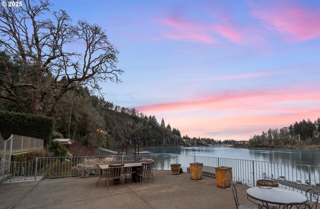 12760 S Fielding Rd, Lake Oswego, OR 97034 - back of property with fence, a patio, a chimney, a tiled roof, and stairway