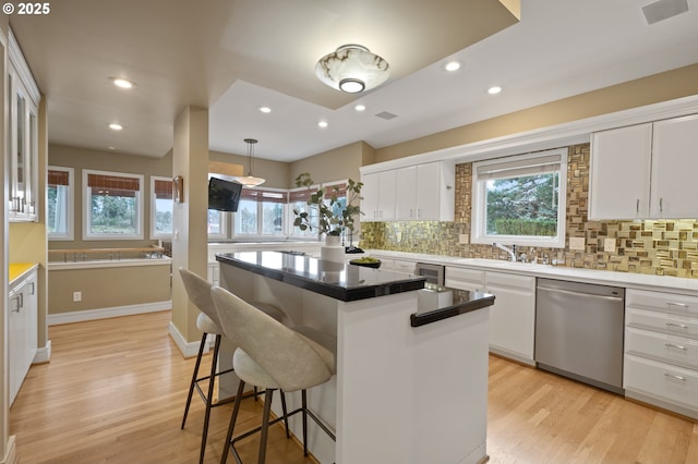 12760 S Fielding Rd, Lake Oswego, OR 97034 - foyer entrance featuring ornate columns, a high ceiling, and light wood-style floors