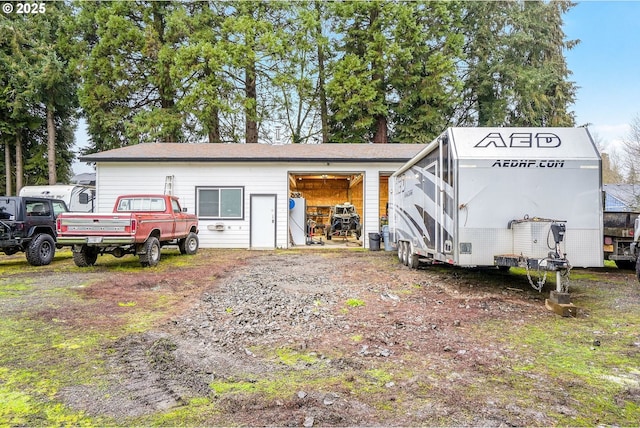 view of outbuilding with an outbuilding and driveway