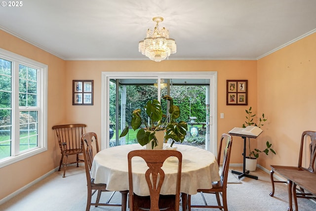 dining area with light colored carpet, baseboards, and ornamental molding