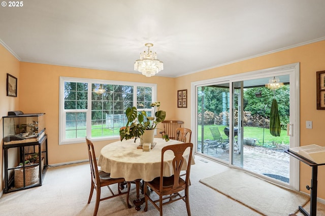 dining space with visible vents, light carpet, a notable chandelier, ornamental molding, and baseboards