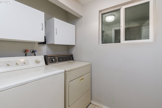 20753 SW Martinazzi Ave, Tualatin, OR 97062 - laundry room with washing machine and clothes dryer, cabinet space, and baseboards