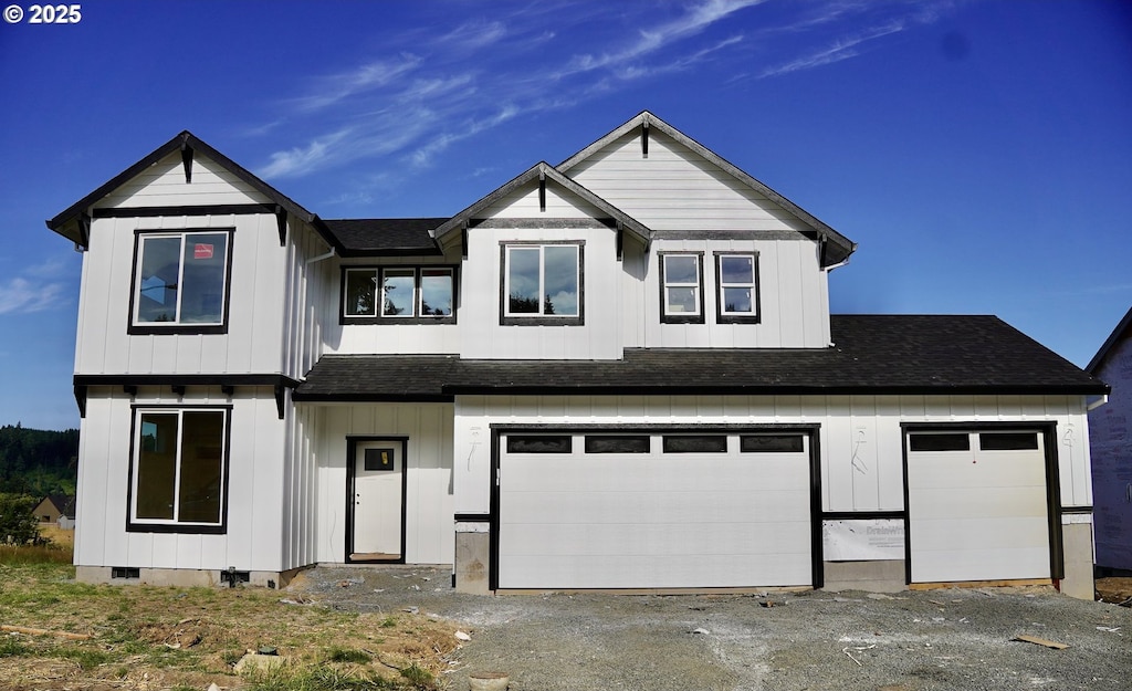 109 Wild Duck, Silverton, OR 97381 - view of front of property with a shingled roof, driveway, an attached garage, and board and batten siding