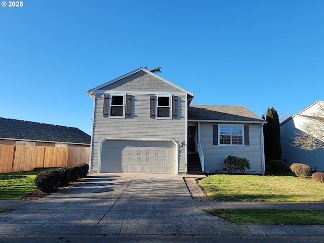 view of front facade featuring a garage and a front lawn