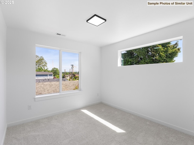 3827 N Willis Blvd, Portland, OR 97217 - carpeted spare room featuring baseboards