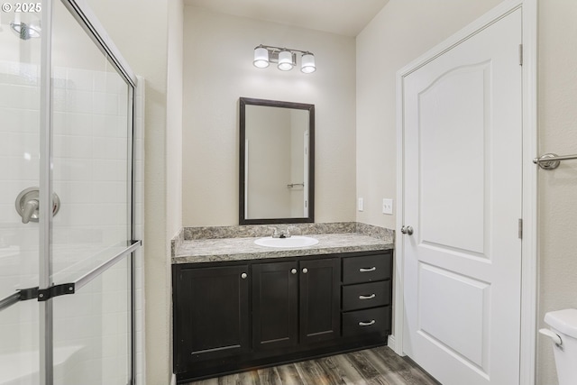 14426 NW Larson Rd Unit 2, Portland, OR 97231 - bathroom featuring wood finished floors, a shower stall, and vanity