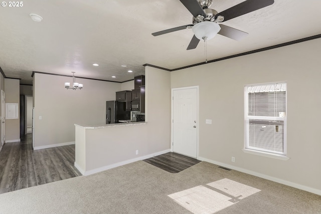 14426 NW Larson Rd Unit 2, Portland, OR 97231 - unfurnished living room with a chandelier, ornamental molding, baseboards, a ceiling fan, and recessed lighting