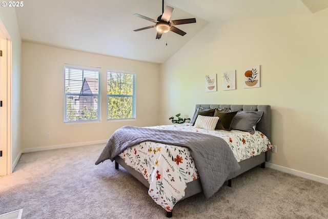 bedroom with carpet flooring, baseboards, and lofted ceiling