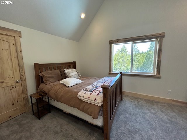 carpeted bedroom with recessed lighting, baseboards, and lofted ceiling