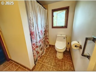 175 W Baltimore St, Heppner, OR 97836 - bathroom with toilet, tile patterned floors, and a shower with shower curtain