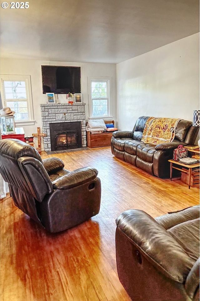 175 W Baltimore St, Heppner, OR 97836 - living area with wood finished floors and a stone fireplace