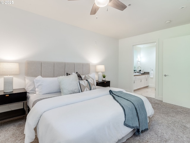 790 NW Westover Sq Unit 8, Portland, OR 97210 - bedroom with light carpet, ensuite bathroom, and ceiling fan