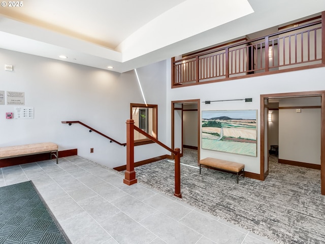 790 NW Westover Sq Unit 8, Portland, OR 97210 - stairs featuring carpet, tile patterned floors, recessed lighting, baseboards, and vaulted ceiling