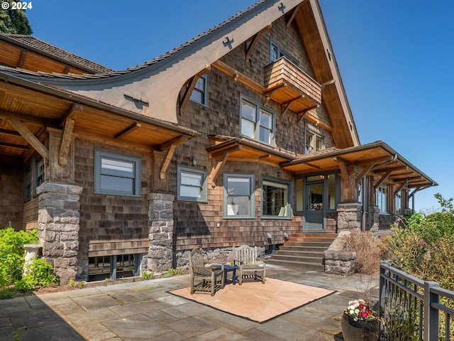 rear view of property with a patio area