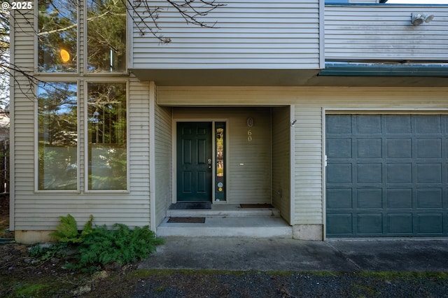 doorway to property with a garage