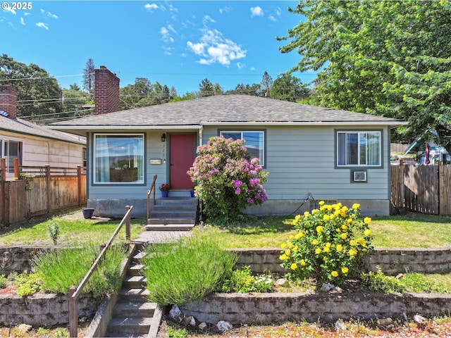 722 E 14th St, The Dalles, OR 97058 - view of front of house featuring a chimney and roof with shingles