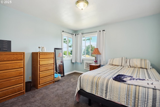 722 E 14th St, The Dalles, OR 97058 - bedroom with dark colored carpet, a wall mounted air conditioner, and baseboards