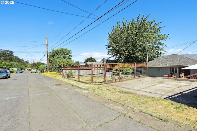 722 E 14th St, The Dalles, OR 97058 - view of asphalt street with curbs and street lights