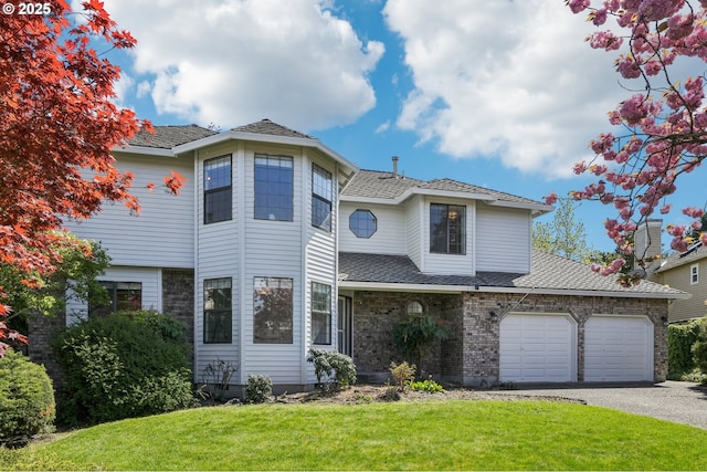 950 NW 161st Ter, Beaverton, OR 97006 - view of front of property featuring an attached garage, aphalt driveway, a front yard, and brick siding