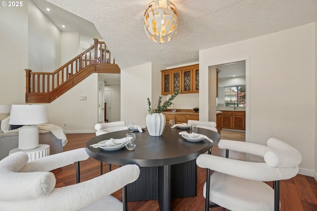 950 NW 161st Ter, Beaverton, OR 97006 - dining space featuring stairway, wood finished floors, a textured ceiling, baseboards, and recessed lighting