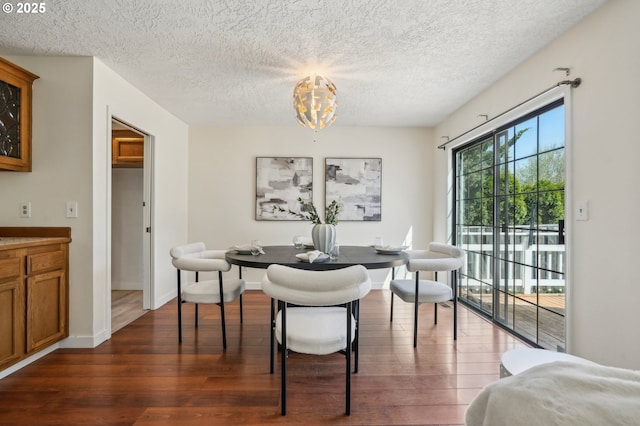 950 NW 161st Ter, Beaverton, OR 97006 - dining area with a chandelier, dark wood finished floors, and a textured ceiling