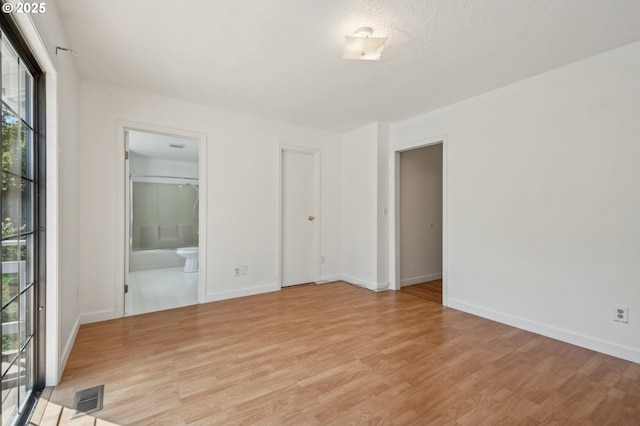 950 NW 161st Ter, Beaverton, OR 97006 - spare room featuring light wood-type flooring, visible vents, and a wealth of natural light