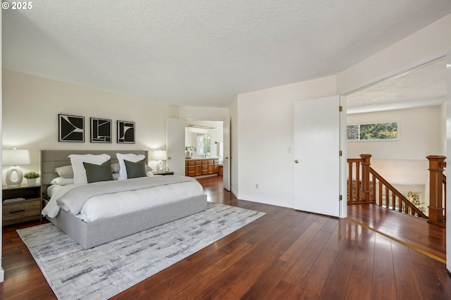 950 NW 161st Ter, Beaverton, OR 97006 - bedroom featuring a textured ceiling, dark wood-style floors, and multiple windows