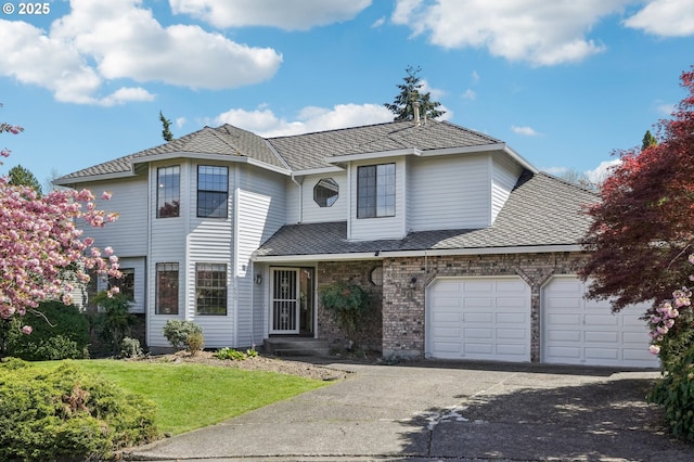950 NW 161st Ter, Beaverton, OR 97006 - traditional-style home featuring a garage, brick siding, a front lawn, and aphalt driveway