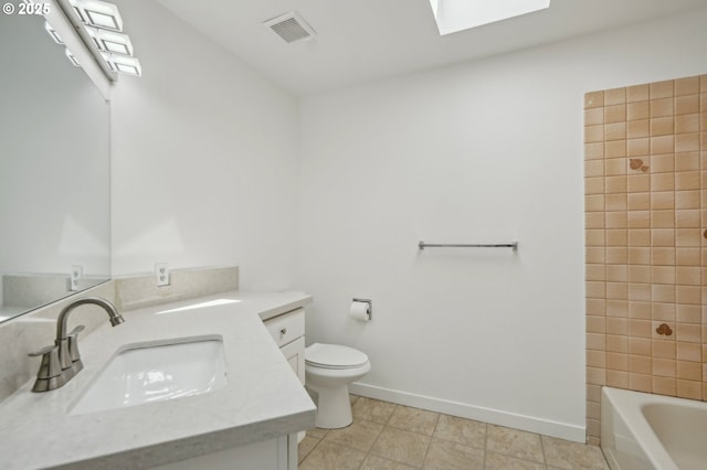 950 NW 161st Ter, Beaverton, OR 97006 - bathroom featuring visible vents, toilet, vanity, a skylight, and baseboards