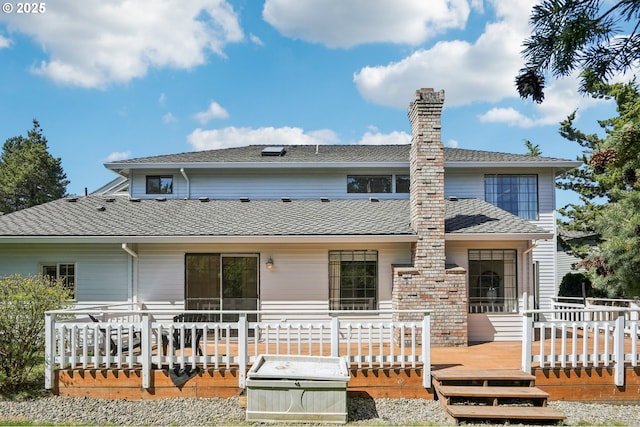 950 NW 161st Ter, Beaverton, OR 97006 - rear view of house featuring a wooden deck, a shingled roof, and a chimney