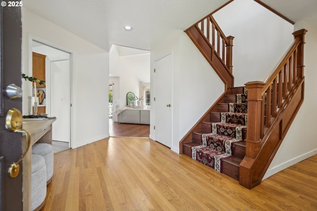 950 NW 161st Ter, Beaverton, OR 97006 - foyer with recessed lighting, stairs, wood finished floors, and baseboards